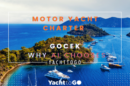 Noleggio Yacht a Motore a Gocek: Perché Scegliere Yachttogo? La Risposta dei Gemelli? 1 A sleek luxury motor yacht cutting through the crystal-clear turquoise waters of the göcek twelve islands, surrounded by pine-clad mountains.